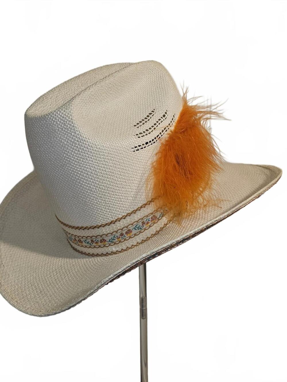White Resistol straw cowboy hat with orange feather